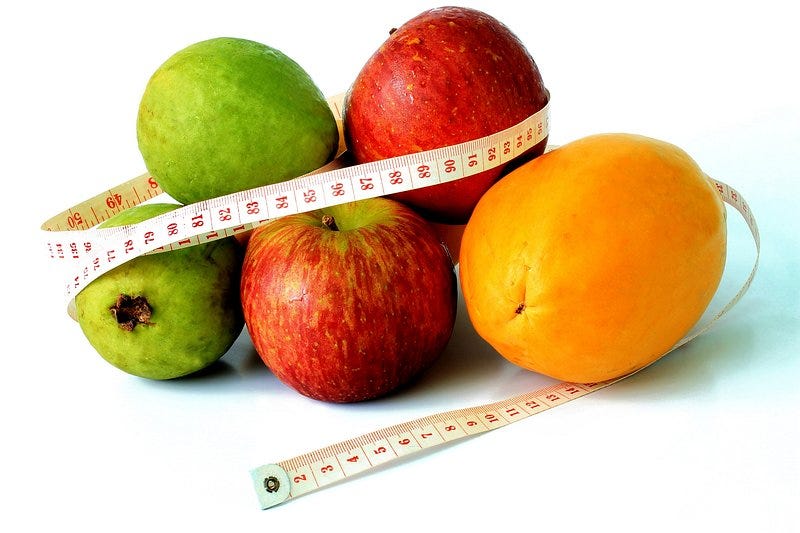 A person exercising and eating healthy to gradually lose weight over time
