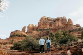 “Romantic couple enjoying a budget-friendly vacation in the USA, with scenic nature views and cozy experiences.”